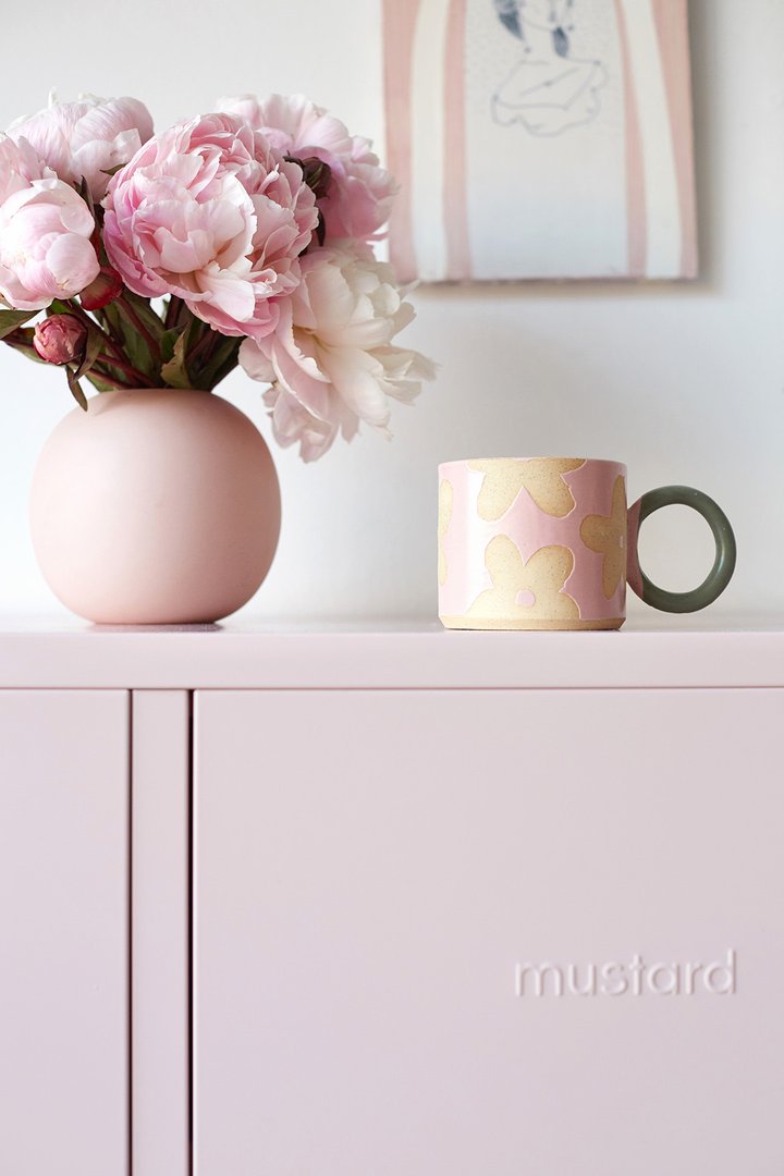 Mustard Made The Midi Locker closeup of mug and flowers sitting in top