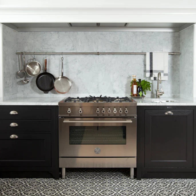 Bertazzoni Range COoker in a kitchen with black countertops