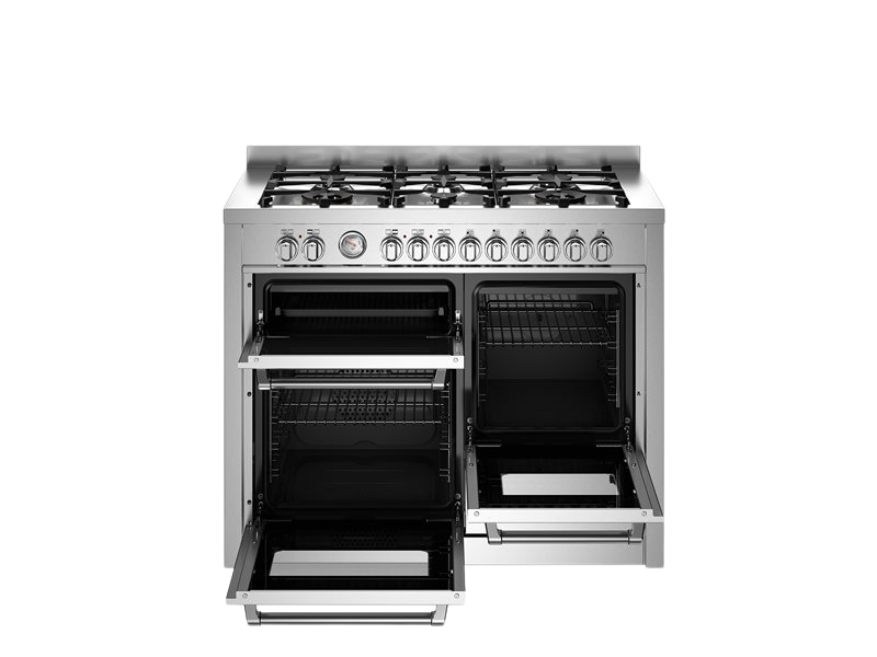 Stainless steel kitchen range with open oven doors on a white background