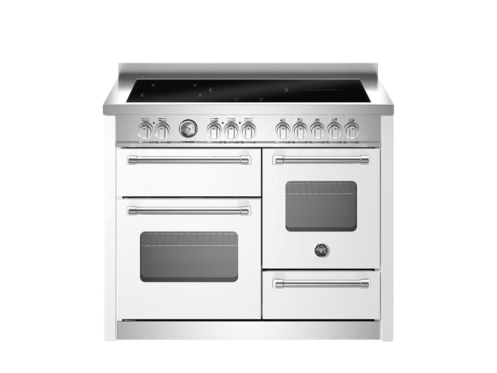 Stainless steel kitchen range with multiple ovens on a white background