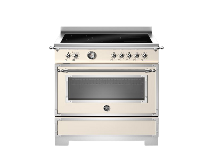 Stainless steel and cream-colored oven on a white background