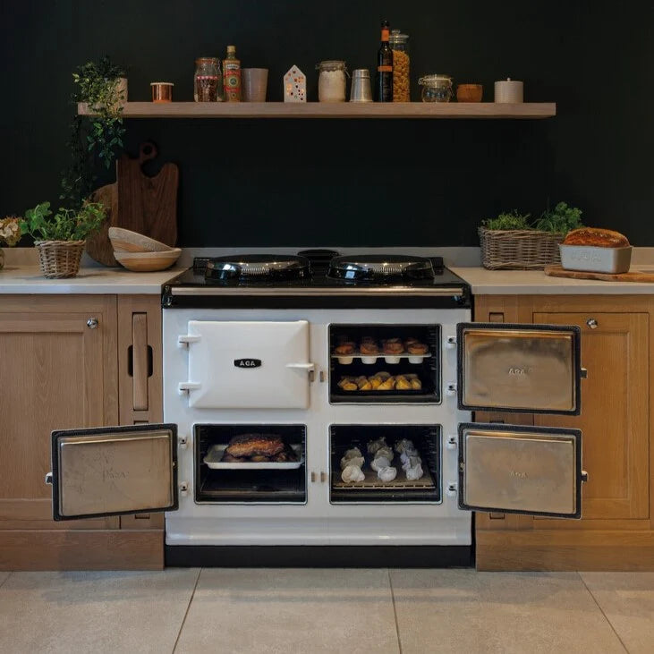 aga kitchen stove with open doors in a rustic kitchen setting.