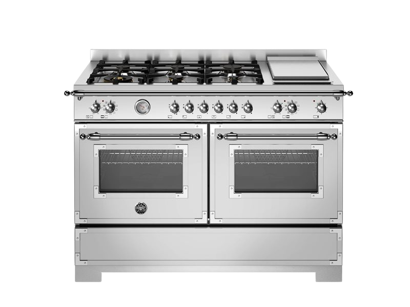 Stainless steel kitchen range with gas cooktop and ovens on a white background