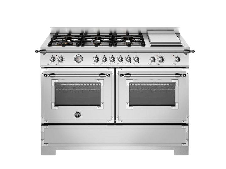 Stainless steel kitchen range with gas cooktop and ovens on a white background
