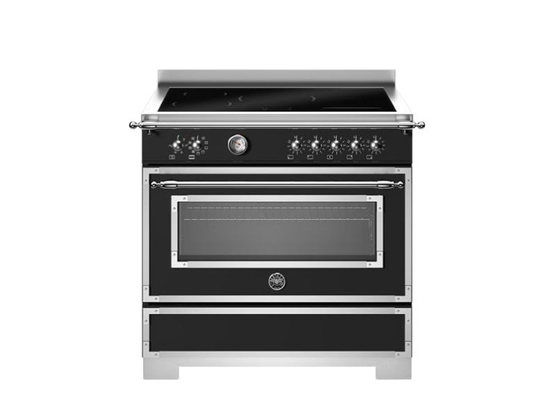 Stainless steel oven with black glass door on a white background