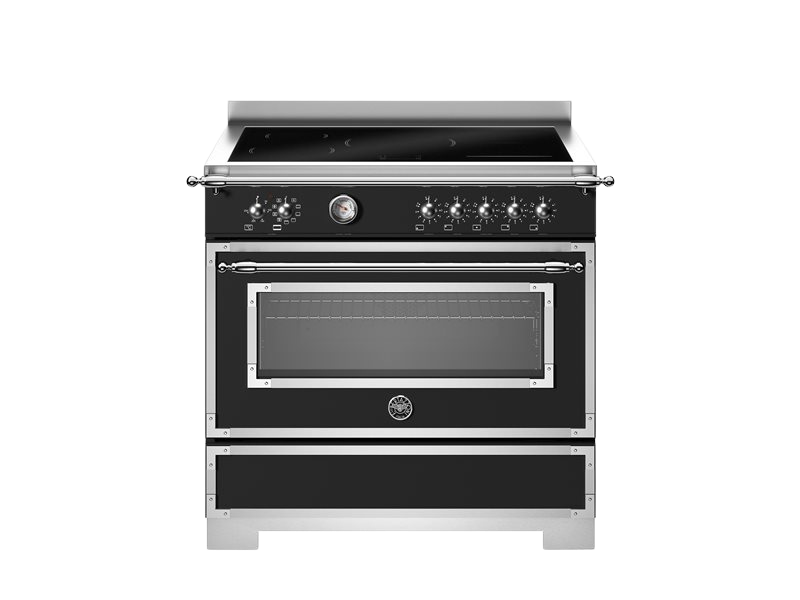 Stainless steel oven with black glass door on a white background