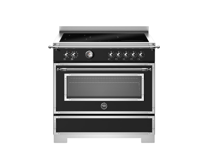 Stainless steel oven with black glass door on a white background