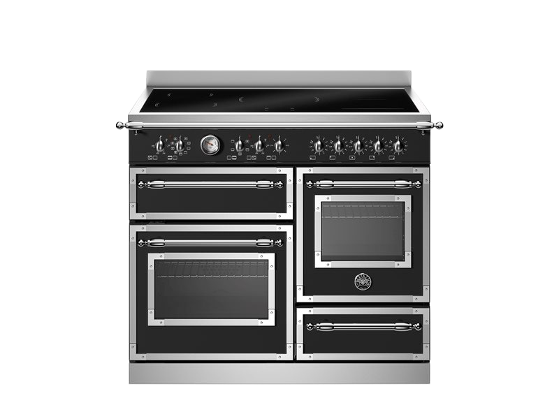 Stainless steel kitchen range with multiple ovens on a white background