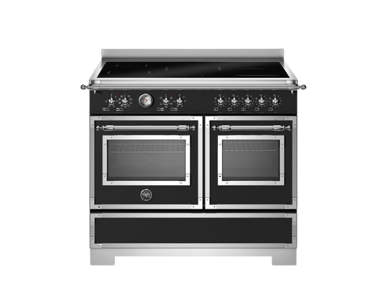 Stainless steel kitchen range with dual ovens on a white background