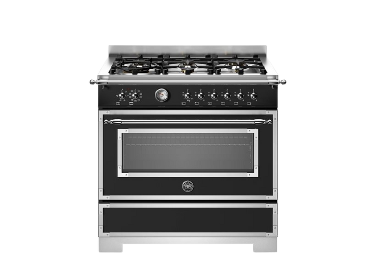 Black stove with silver trim on a white background