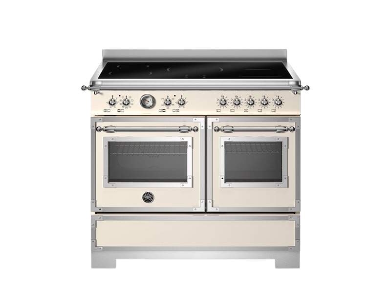 Stainless steel and cream-colored kitchen range with dual ovens on a white background