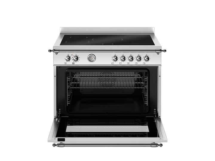 Stainless steel oven with open door on a white background