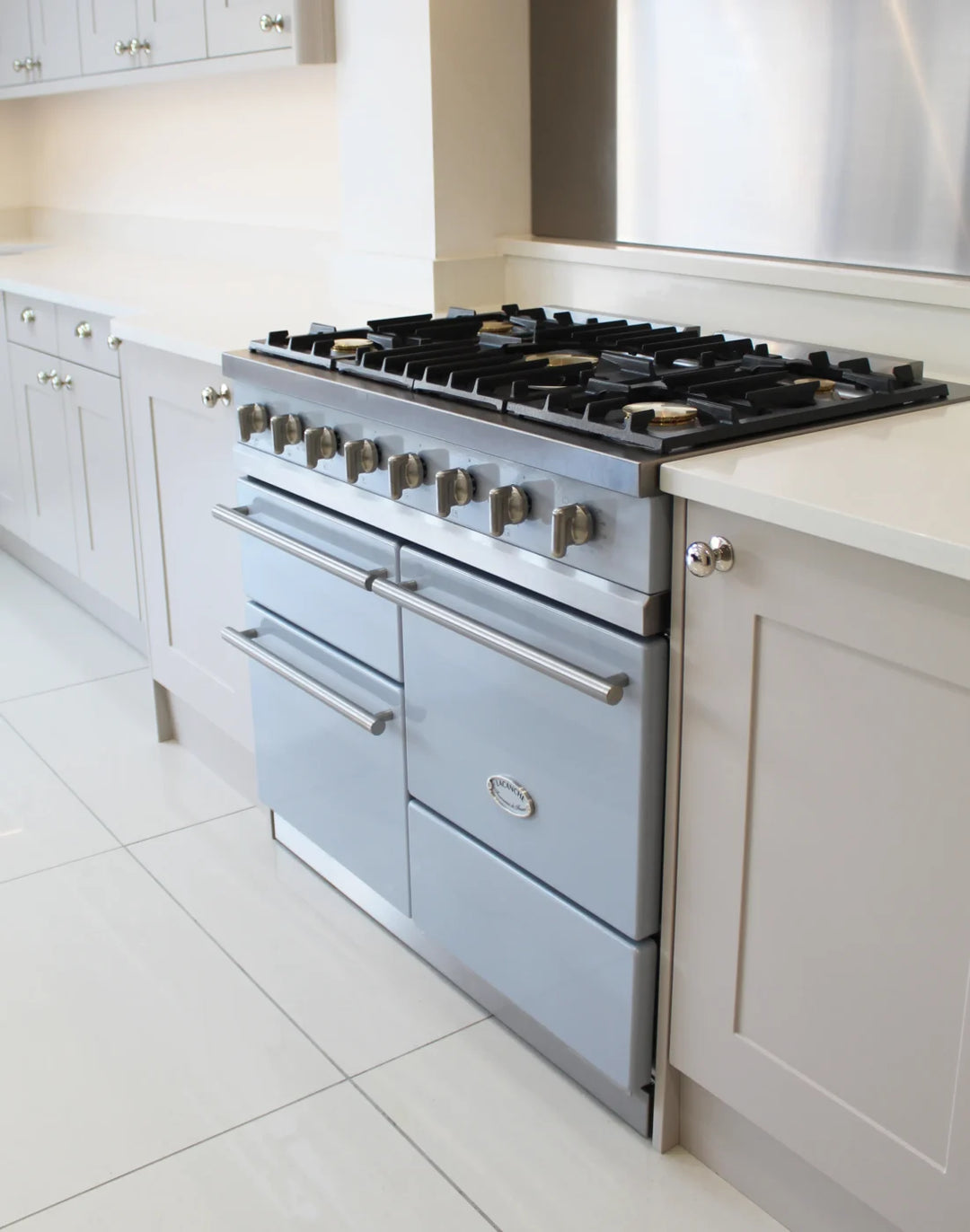 All gas Lacanche classic range cooker inside a white kitchen with a light blue coloured exterior