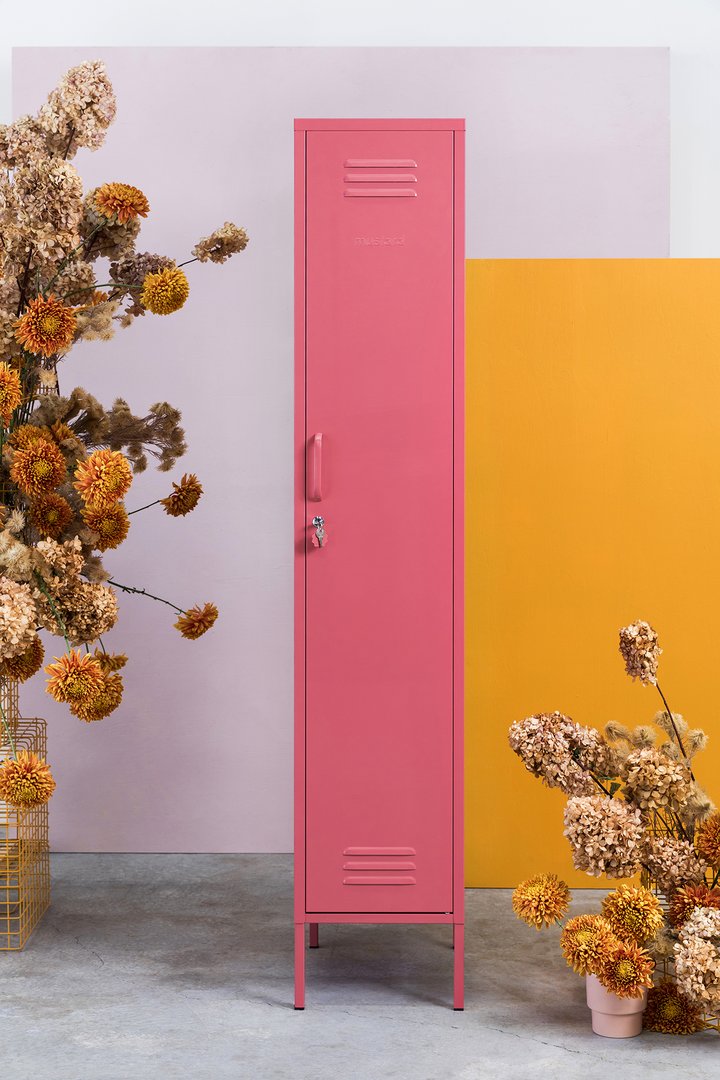Mustard Made The Skinny Locker in blush beside yellow foliage and a yellow backdrop with the door closed