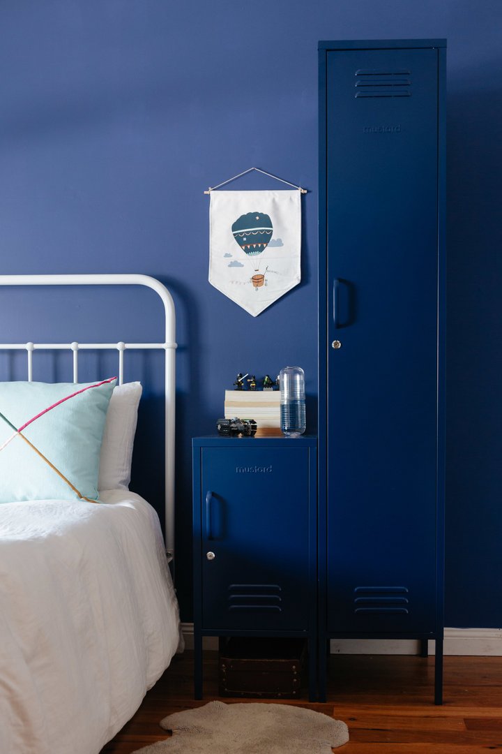 Mustard Made The Skinny Locker in navy beside a shorty that is also navy both with the doors closed in a bedroom
