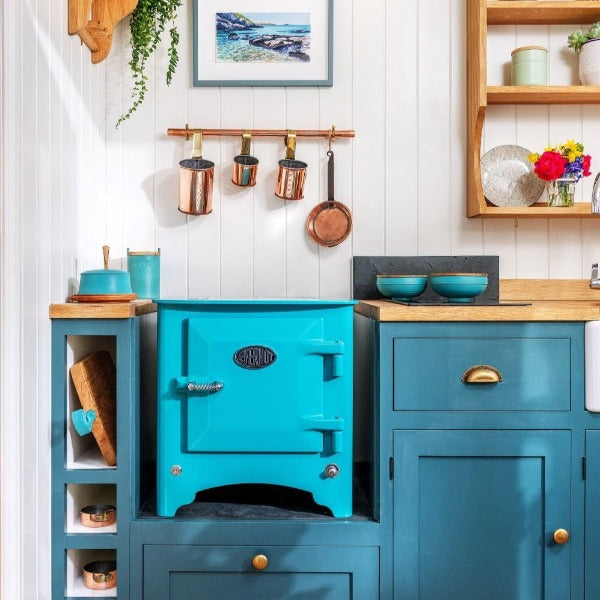 Blue Everhot stove sat on counter in blue kitchen